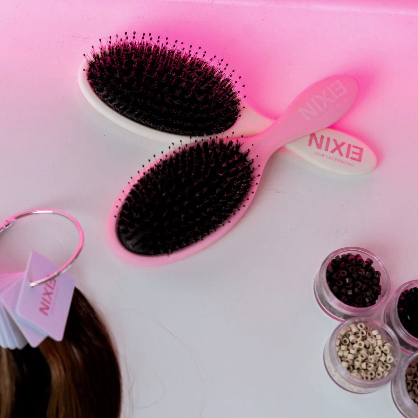 Photo of Nixie Hair Brushes in white and pink color options